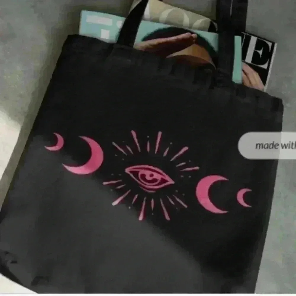 Black recycled canvas tote bag with moon phases and evil eye